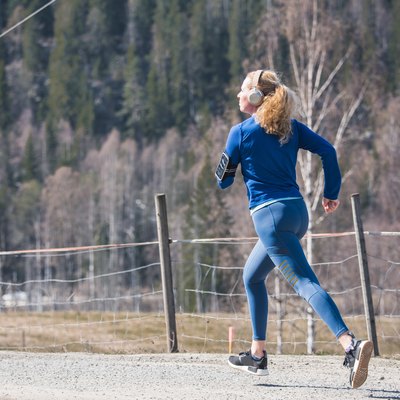 Young female running in nature.