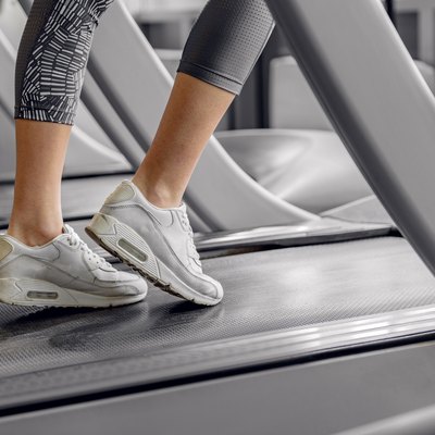 Legs of woman running on treadmill