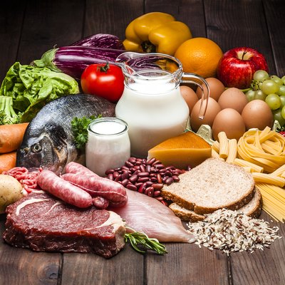 Different types of food on rustic wooden table