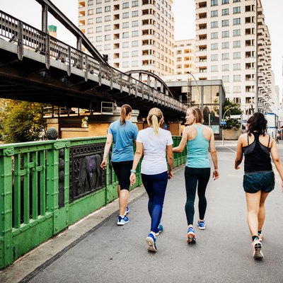 Fitness Group Cooling Down After City Run
