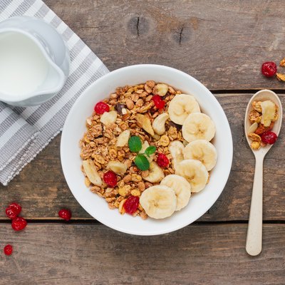 Granola with banana and berries in the bowl