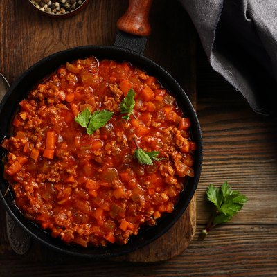 Bolognese sauce in pan top view