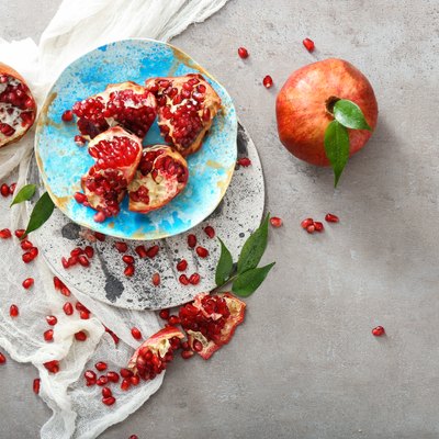 Composition with tasty pomegranates on table
