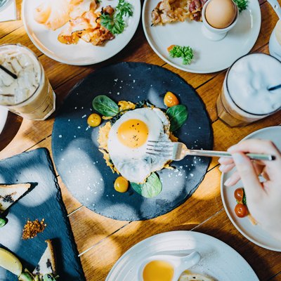 Directly above view of woman sharing a variation of meals for intermittent fasting keto and keto fasting