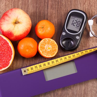 Electronic bathroom scale and glucometer, stethoscope and healthy food