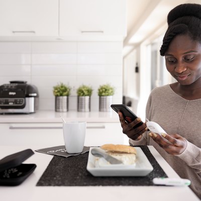 African woman taking blood sugar level in different time of the day