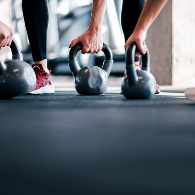 Cross training with kettle bells, low angle image, copy space.