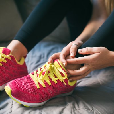 Young sport woman with injured ankle