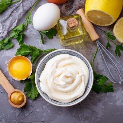 Homemade mayonnaise sauce and olive oil, eggs, mustard, lemon