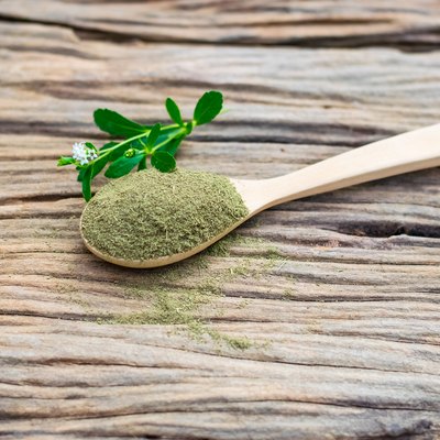 Stevia powder in wooden spoon