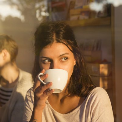 Woman drinking coffee to get health benefits of coffee