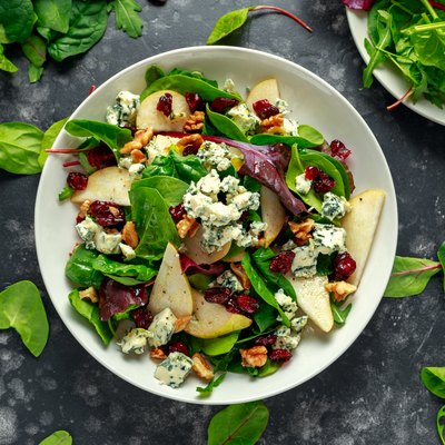 Fresh Pears, Blue Cheese salad with vegetable green mix, walnuts, cranberry. healthy food