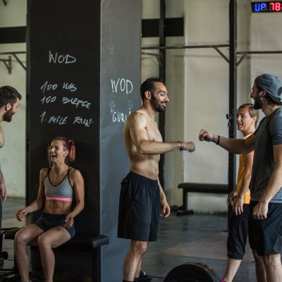 People motivating each other to keep going during the 30-day burpee challenge