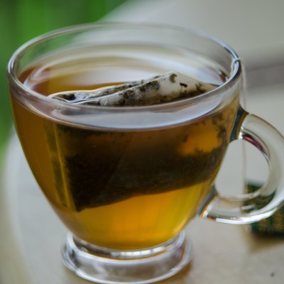 Close-Up Of Green Tea In Cup On Table