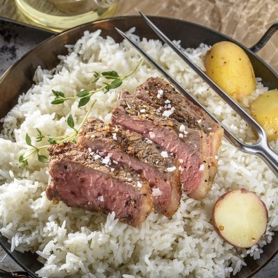 Sliced Grilled Steak with Sea Salt over Steamed Rice