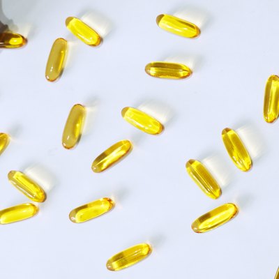 Fish oil capsule on white background
