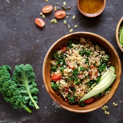 Quinoa salad with kale, cherry tomatoes and pumpkin seeds