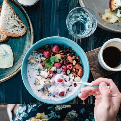 Cropped Image Of Woman Having Breakfast At Table