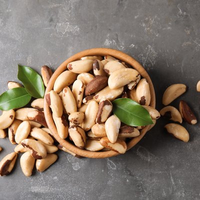 Flat lay composition with Brazil nuts on grey background