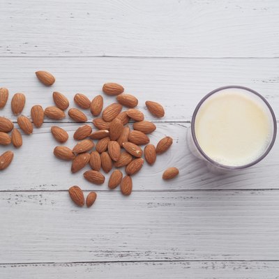 milk and almonds nut on table