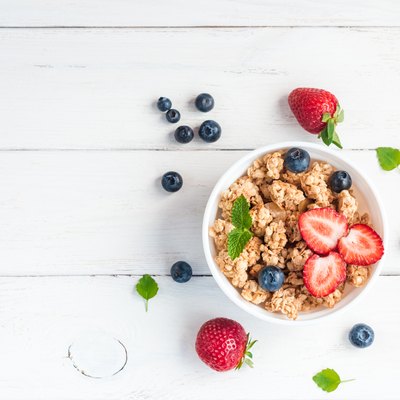 healthy breakfast with muesli and berries, top view, flat lay