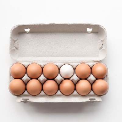 Brown eggs with one white egg from above