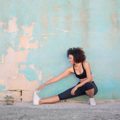 Girl doing stretching in the street