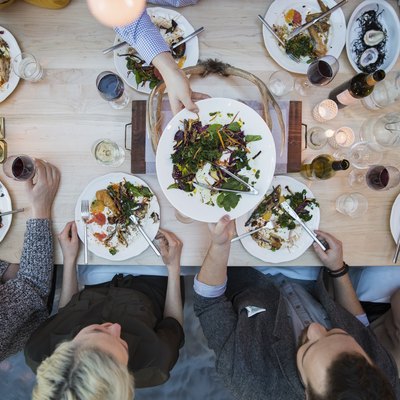 View from above of a group of friends eating at a restaurant table