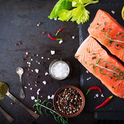 Raw salmon fillet and ingredients for cooking