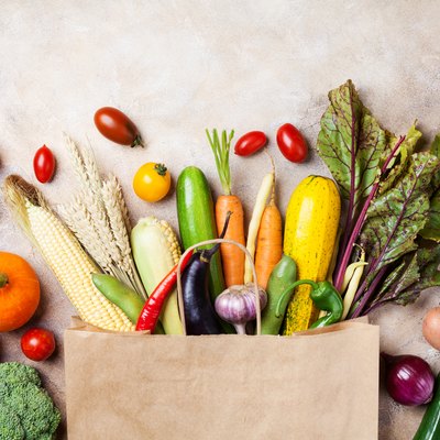 healthy autumn vegetables in paper grocery bag