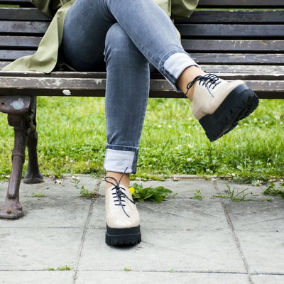Woman sitting on a bench in a park