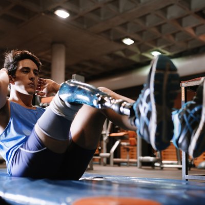 Disabled young man training in the gym