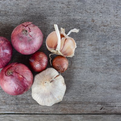 Top View Of Onions And Garlic Wood