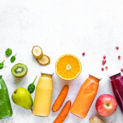 Various smoothies bottles and ingredients