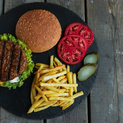 Directly Above Shot Of Burgers And French Fries On Table