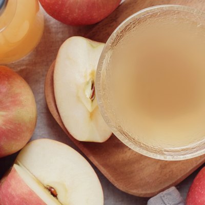 Apple cider vinegar with mother in glass bowl, probiotics food for gut health.
