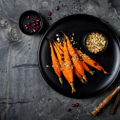 Roasted carrots with dukkah. Vegetarian food. Top view, flat lay, copy space