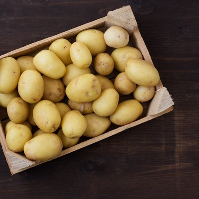 Overhead view of a crate of fresh potatoes