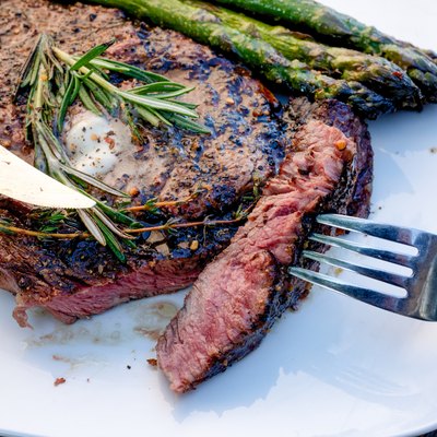 Delicious Rib Eye Steak Grilled to Perfection with Asparagus on the Side Ready to Eat