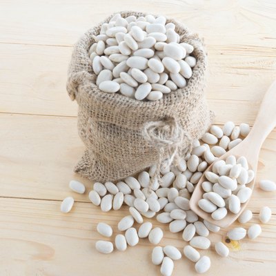 white bean in hemp sack on sack background