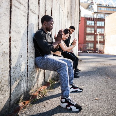Wall sitting exercise urban outdoor gym in NYC