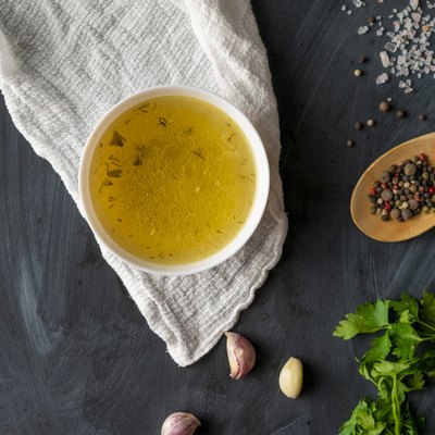 home cooked boullion or clear soup in a ceramic bowl at the kitchen, healthy food and diets