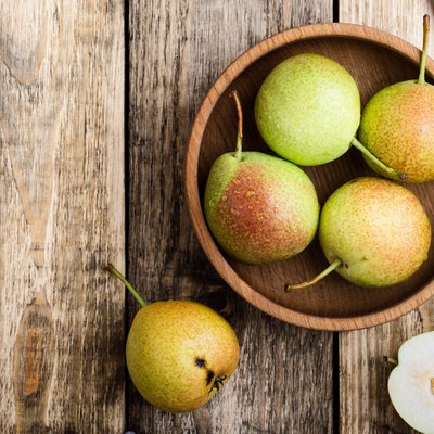 Ripe pears on rustic table