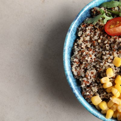 Healthy quinoa salad with vegetables in bowl to illustrate quinoa nutrition and carbs