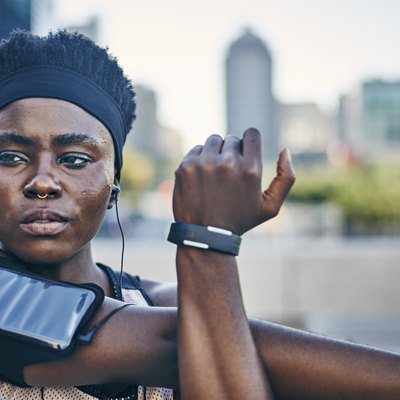 Young female runner about to do a summer workout