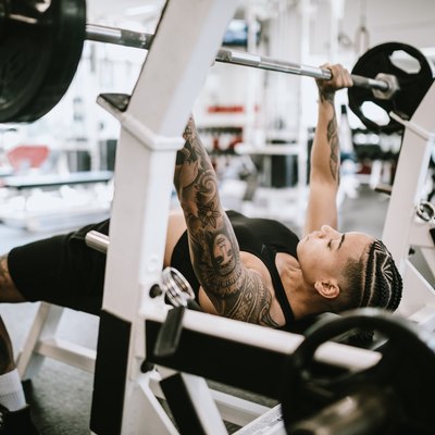 Strong and Fit Woman Working Out in Gym