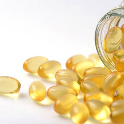 Fish oil and Evening Primrose capsules pills and container