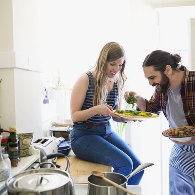 Couple cooking together at home