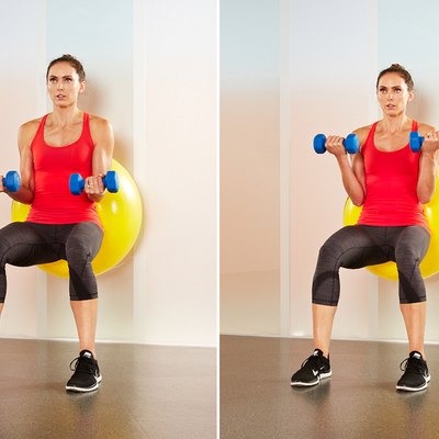 Woman performing stability-ball biceps curls.