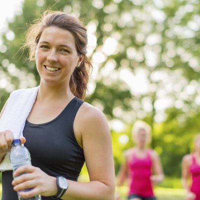 Healthy girl holding a water bottle